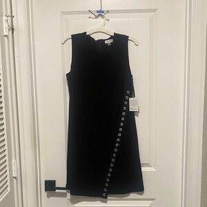 Calvin Klein Black Asymmetrical Dress with Silver Eyelets